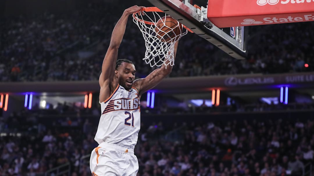 Nov 26, 2023; New York, New York, USA;  Phoenix Suns forward Keita Bates-Diop (21) dunks in the first quarter against the New York Knicks at Madison Square Garden. Mandatory Credit: Wendell Cruz-Imagn Images
