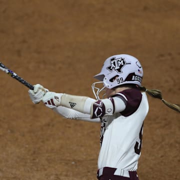 May 8, 2025; Athens, GA, USA; Texas A&M outfielder Kelsey Mathis (99) hits a single during a game against South Carolina at Jack Turner Stadium. Mandatory Credit: Mady Mertens-Imagn Images