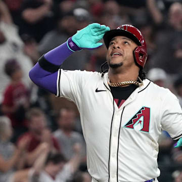 Sep 11, 2024; Phoenix, Arizona, USA; Arizona Diamondbacks second base Ketel Marte (4) reacts after hitting a three-run home run against the Texas Rangers in the fourth inning at Chase Field. Mandatory Credit: Rick Scuteri-Imagn Images