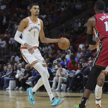 Feb 7, 2024; Miami, Florida, USA; San Antonio Spurs center Victor Wembanyama (1) dribbles the basketball against the Miami Heat during the third quarter at Kaseya Center. 