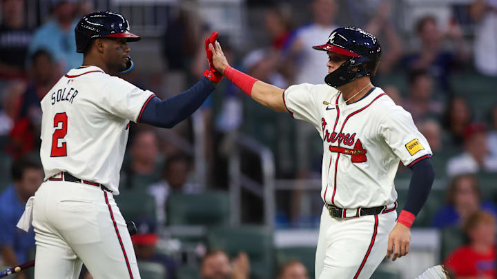 Sep 3, 2024; Atlanta, Georgia, USA; Atlanta Braves third baseman Gio Urshela (9) celebrates with right fielder Jorge Soler (2) after scoring a run against the Colorado Rockies in the third inning at Truist Park. Mandatory Credit: Brett Davis-Imagn Images 
