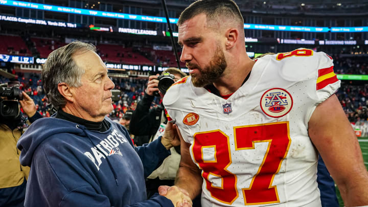 Dec 17, 2023; Foxborough, Massachusetts, USA; New England Patriots head coach Bill Belichick and Kansas City Chiefs tight end Travis Kelce (87) on the field after the game at Gillette Stadium. Mandatory Credit: David Butler II-USA TODAY Sports