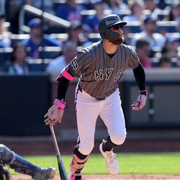 Jul 5, 2025; New York City, New York, USA; New York Mets left fielder Brandon Nimmo (9) follows through on a grand slam against the New York Yankees during the first inning at Citi Field. Mandatory Credit: Brad Penner-Imagn Images