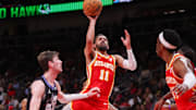 Apr 6, 2025; Atlanta, Georgia, USA; Atlanta Hawks guard Trae Young (11) shoots against the Utah Jazz in the second quarter at State Farm Arena. Mandatory Credit: Brett Davis-Imagn Images