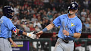 Tampa Bay Rays Kameron Misner (right) and Chandler Simpson celebrate after scoring against the Arizona Diamondbacks.