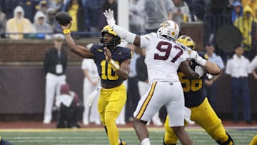 Sep 28, 2024; Ann Arbor, Michigan, USA;  Michigan Wolverines quarterback Alex Orji (10) passes in the first half against the Minnesota Golden Gophers at Michigan Stadium. Mandatory Credit: Rick Osentoski-Imagn Images