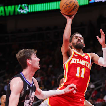 Apr 6, 2025; Atlanta, Georgia, USA; Atlanta Hawks guard Trae Young (11) shoots against the Utah Jazz in the second quarter at State Farm Arena. Mandatory Credit: Brett Davis-Imagn Images