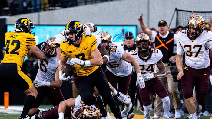 Iowa defensive back Cooper DeJean (3) runs back a punt for a touchdown at Kinnick Stadium on