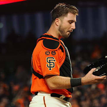 Sep 8, 2023; San Francisco, California, USA; San Francisco Giants catcher Joey Bart (21) looks at his helmet after allowing a run by the Colorado Rockies during the second inning at Oracle Park.