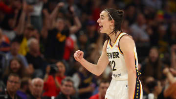 Indiana Fever guard Caitlin Clark (22) celebrates against the Phoenix Mercury during a WNBA game at Footprint Center.