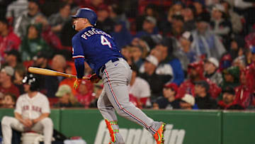 May 6, 2025; Boston, Massachusetts, USA; Texas Rangers designated hitter Joc Pederson (4) hits a ground rule double to drive in a run against the Boston Red Sox in the fourth inning at Fenway Park. Mandatory Credit: David Butler II-Imagn Images