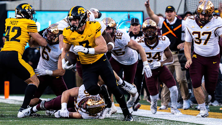Iowa defensive back Cooper DeJean (3) runs back a punt for a touchdown at Kinnick Stadium on Saturday, October 21, 2023 in Iowa City. The touchdown was overturned after review.