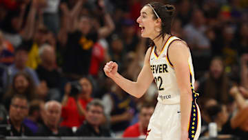 Jun 30, 2024; Phoenix, Arizona, USA; Indiana Fever guard Caitlin Clark (22) celebrates against the Phoenix Mercury during a WNBA game at Footprint Center.