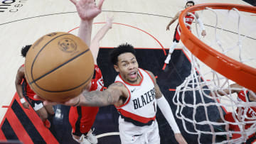 Mar 8, 2024; Portland, Oregon, USA; Portland Trail Blazers shooting guard Anfernee Simons (1) shoots the ball past Houston Rockets center Alperen Sengun (28) during the second half at Moda Center. Mandatory Credit: Soobum Im-USA TODAY Sports