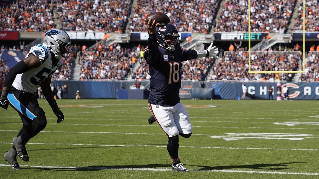 Caleb Williams finds the end zone during a 2024 game against Carolina, team the Bears face in the opener.