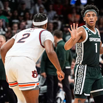Michigan State guard Jeremy Fears Jr. (1) dribbles against Auburn guard Denver Jones (2) during the first half of the Elite Eight round of NCAA tournament at State Farm Arena in Atlanta on Sunday, March 30, 2025.