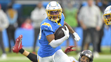 Dec 15, 2024; Inglewood, California, USA;  Los Angeles Chargers cornerback Tarheeb Still (29) intercepts a pass intended for Tampa Bay Buccaneers wide receiver Mike Evans (13) in the first half at SoFi Stadium. Mandatory Credit: Jayne Kamin-Oncea-Imagn Images