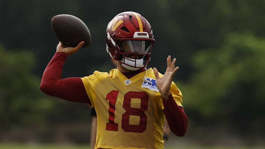 Jul 23, 2025; Ashburn, VA, USA; Washington Commanders quarterback Marcus Mariota (18) passes a ball during practice on day one of training camp at OrthoVirginia Training Center at Commanders Park. Mandatory Credit: Geoff Burke-Imagn Images | Geoff Burke-Imagn Images
