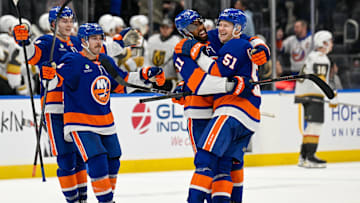 Dec 9, 2025; Elmont, New York, USA; New York Islanders left wing Emil Heineman (51) celebrates his winning goal with New York Islanders left wing Anthony Duclair (11) after shootouts against the Vegas Golden Knights at UBS Arena. Mandatory Credit: Dennis Schneidler-Imagn Images