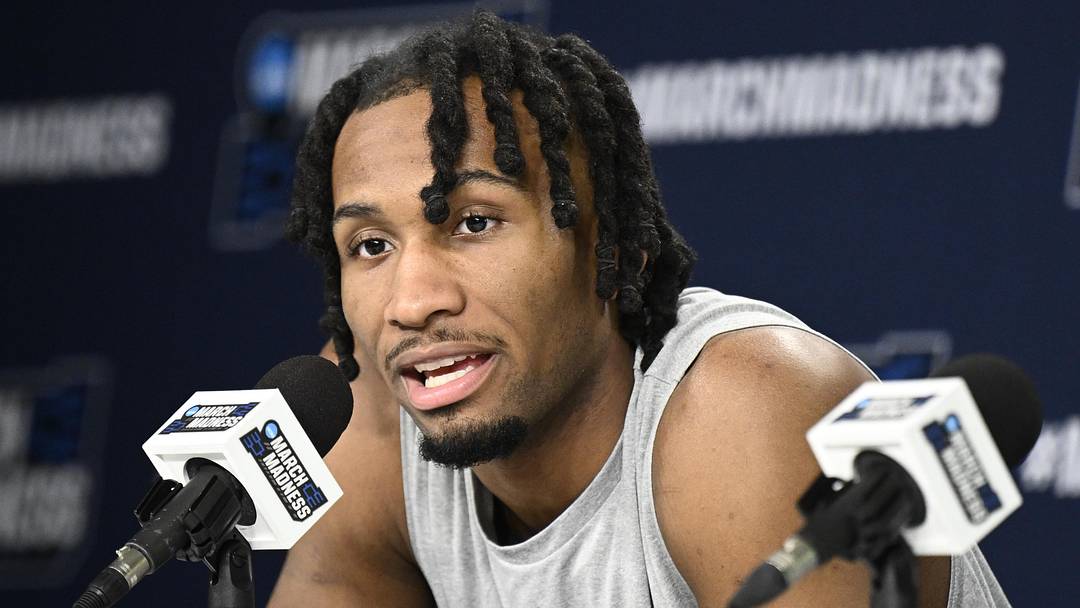 Mar 19, 2026; San Diego, CA, USA; Kansas Jayhawks guard Darryn Peterson (22) speaks at a news conference ahead of the first round of the men's 2026 NCAA Tournament at Viejas Arena.