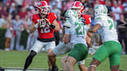 Georgia Bulldogs quarterback Ryan Puglisi (12) passes against the Marshall Thundering Herd during a college football game