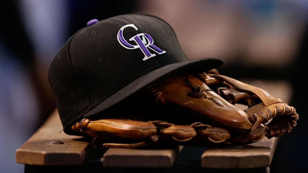 Jun 20, 2017; Denver, CO, USA; A general view of a Colorado Rockies hat and glove in the sixth inning of the game against the Arizona Diamondbacks at Coors Field.