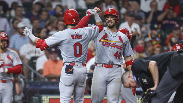 Jun 4, 2024; Houston, Texas, USA; St. Louis Cardinals shortstop Masyn Winn (0) celebrates with catcher Ivan Herrera (48) after hitting a home run during the sixth inning against the Houston Astros at Minute Maid Park. Mandatory Credit: Troy Taormina-USA TODAY Sports