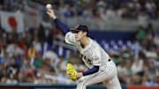 Mar 20, 2023; Miami, Florida, USA; Japan starting pitcher Roki Sasaki (14) delivers a pitch during the first inning against Mexico at LoanDepot Park. 