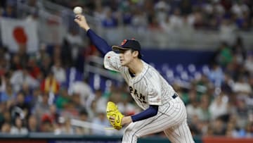 Mar 20, 2023; Miami, Florida, USA; Japan starting pitcher Roki Sasaki (14) delivers a pitch during the first inning against Mexico at LoanDepot Park. 