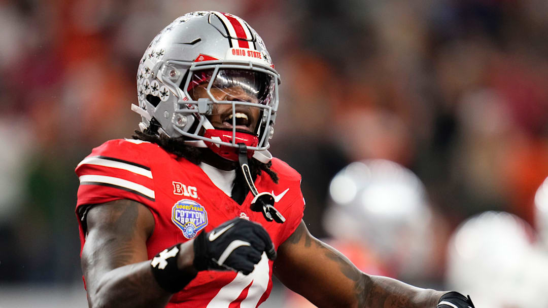 Ohio State Buckeyes wide receiver Jeremiah Smith (4) celebrates a touchdown during the Cotton Bowl at AT&T Stadium in Arlington, Texas for the College Football Playoff quarterfinal game against the Miami Hurricanes on Dec. 31, 2025. Ohio State lost 24-14.