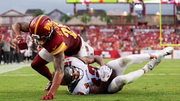 Sep 8, 2024; Tampa, Florida, USA; Tampa Bay Buccaneers wide receiver Mike Evans (13) catches a pass for a touchdown defended by Washington Commanders cornerback Benjamin St-Juste (25) in the fourth quarter at Raymond James Stadium. Mandatory Credit: Nathan Ray Seebeck-Imagn Images