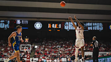 Dec 29, 2024; Tuscaloosa, Alabama, USA; Alabama Crimson Tide guard Aden Holloway (2) shoots against South Dakota State Jackrabbits guard Joe Sayler (3) during the second half at Coleman Coliseum. Mandatory Credit: Will McLelland-Imagn Images