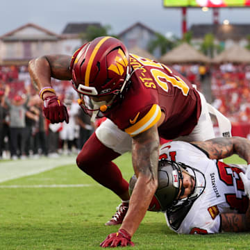 Sep 8, 2024; Tampa, Florida, USA; Tampa Bay Buccaneers wide receiver Mike Evans (13) catches a pass for a touchdown defended by Washington Commanders cornerback Benjamin St-Juste (25) in the fourth quarter at Raymond James Stadium. Mandatory Credit: Nathan Ray Seebeck-Imagn Images