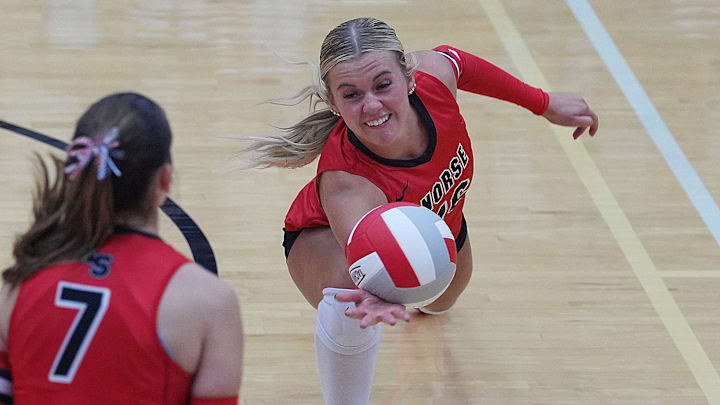 Roland-Story's right-side hitter/outside hitter Emma Truesdell (16) dives for the ball against Nevada during the third set at Roland-Story High School gym l Sept 18, 2025, in Story City, Iowa. Roland-Story's right-side hitter/outside hitter Emma Truesdell (16) dives for the ball against Nevada during the third set at Roland-Story High School gym l Sept 18, 2025, in Story City, Iowa.