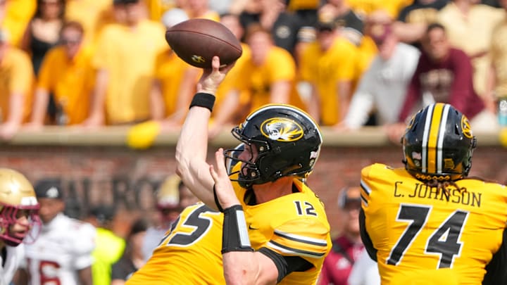 Sep 14, 2024; Columbia, Missouri, USA; Missouri Tigers quarterback Brady Cook (12) throws a pass against the Boston College Eagles during the second half at Faurot Field at Memorial Stadium. Mandatory Credit: Denny Medley-Imagn Images