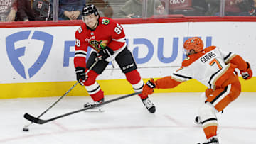 Oct 19, 2025; Chicago, Illinois, USA; Anaheim Ducks defenseman Radko Gudas (7) defends against Chicago Blackhawks center Connor Bedard (98) during the second period at United Center. Mandatory Credit: Kamil Krzaczynski-Imagn Images