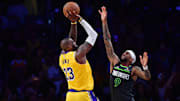 Apr 30, 2025; Los Angeles, California, USA; Los Angeles Lakers forward LeBron James (23) shoots against Minnesota Timberwolves guard Nickeil Alexander-Walker (9) 
