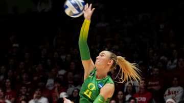 Oregon outside hitter Daley McClellan (4) serves the ball during the first set of the NCAA Regional Volleyball Finals match against Wisconsin on Saturday, December 9, 2023, at the UW Field House in Madison, Wis.