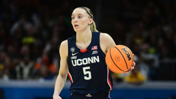 Apr 5, 2024; Cleveland, OH, USA; Connecticut Huskies guard Paige Bueckers (5) dribbles the ball against the Iowa Hawkeyes in the semifinals of the Final Four of the womens 2024 NCAA Tournament at Rocket Mortgage FieldHouse. Mandatory Credit: Ken Blaze-USA TODAY Sports