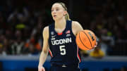 Apr 5, 2024; Cleveland, OH, USA; Connecticut Huskies guard Paige Bueckers (5) dribbles the ball against the Iowa Hawkeyes in the semifinals of the Final Four of the womens 2024 NCAA Tournament at Rocket Mortgage FieldHouse. Mandatory Credit: Ken Blaze-USA TODAY Sports