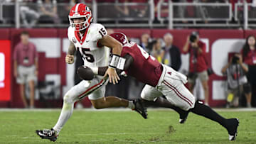 Alabama Crimson Tide defensive back Keon Sabb (3) strips the ball from Georgia Bulldogs quarterback Carson Beck (15)