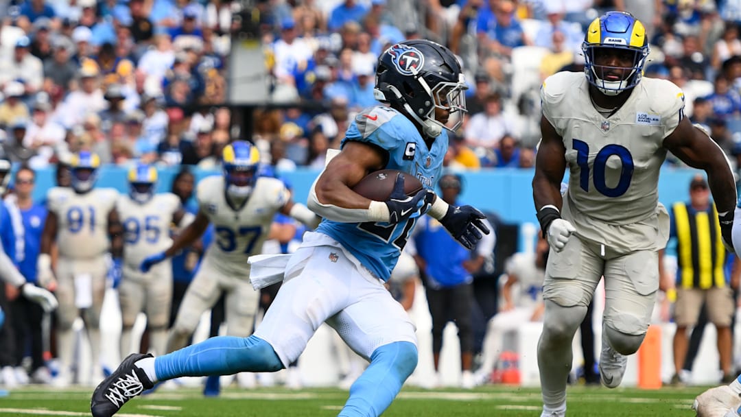 Sep 14, 2025; Nashville, Tennessee, USA;  Tennessee Titans wide receiver Calvin Ridley (0) runs with the ball against the Los Angeles Rams during the second half at Nissan Stadium. Mandatory Credit: Steve Roberts-Imagn Images