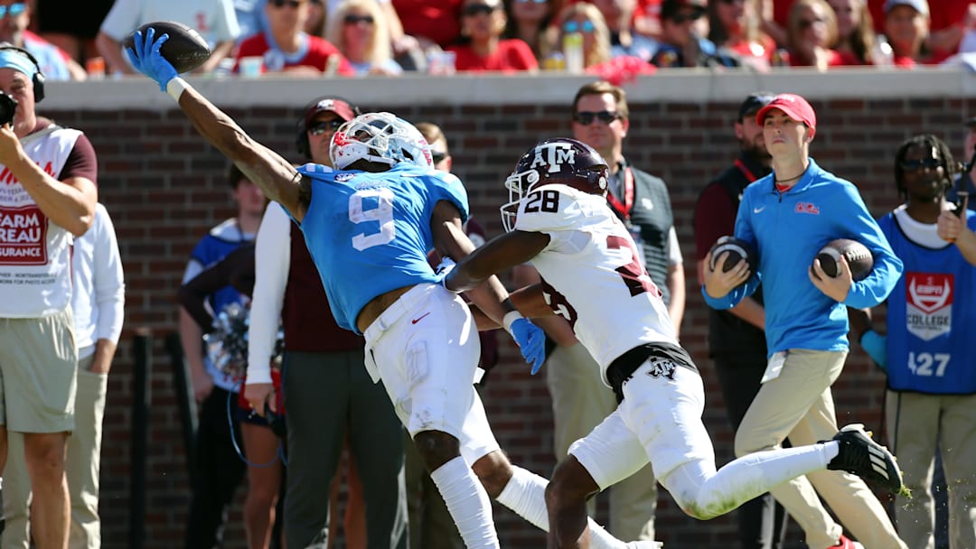 Nov 4, 2023; Oxford, Mississippi, USA; Mississippi Rebels wide receiver Tre Harris (9) makes a one handed catch over Texas A&M Aggies defensive back Josh DeBerry (28) during the second half at Vaught-Hemingway Stadium. Mandatory Credit: Petre Thomas-USA TODAY Sports