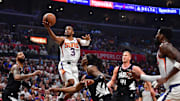Apr 22, 2023; Los Angeles, California, USA; Phoenix Suns guard Chris Paul (3) moves to the basket against Los Angeles Clippers forward Marcus Morris Sr. (8) guard Terance Mann (14) and center Mason Plumlee (44)  during the first half in game four of the 2023 NBA playoffs at Crypto.com Arena. Mandatory Credit: Gary A. Vasquez-Imagn Images