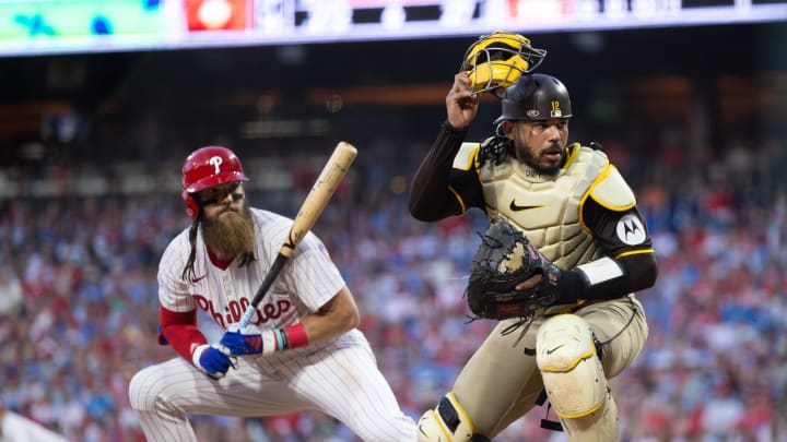 Jun 18, 2024; Philadelphia, Pennsylvania, USA; San Diego Padres catcher Luis Campusano (12) attempts to field a pass ball in front of Philadelphia Phillies outfielder Brandon Marsh (16) at Citizens Bank Park. Mandatory Credit: Bill Streicher-USA TODAY Sports