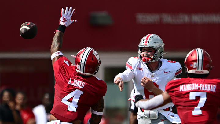 Sep 2, 2023; Bloomington, Indiana, USA; Ohio State Buckeyes quarterback Kyle McCord (6) passes the ball over Indiana Hoosiers linebacker Anthony Jones (4) during the first quarter at Memorial Stadium. Mandatory Credit: Marc Lebryk-USA TODAY Sports