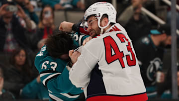 Mar 15, 2025; San Jose, California, USA;  San Jose Sharks center Zack Ostapchuk (63) and Washington Capitals right wing Tom Wilson (43) fight during the second period at SAP Center at San Jose. Mandatory Credit: David Gonzales-Imagn Images