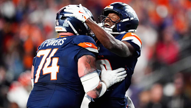 Denver Broncos wide receiver Marvin Mims Jr. (19) celebrates with Denver Broncos guard Ben Powers (74).