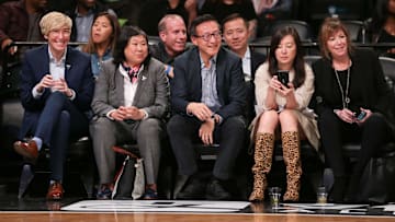 May 9, 2019; New York City, NY, USA; Taiwanese businessman Joe Tsai (center) cheers during the second half of the preseason WNBA game between the New York Liberty and the China National Team at Barclays Center. Mandatory Credit: Vincent Carchietta-Imagn Images