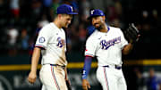 Texas Rangers shortstop Corey Seager (5) celebrates with Texas Rangers second baseman Marcus Semien (2) after the game against the Athletics at Globe Life Field. 